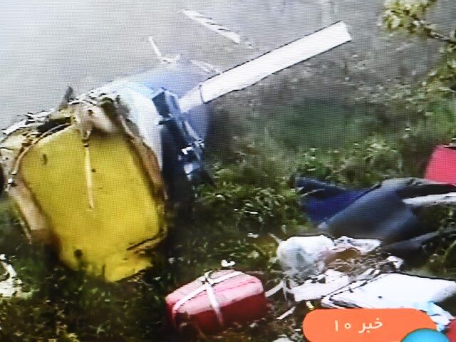 Photo taken on May 20, 2024 shows the wreckage of the crashed helicopter near Varzaqan Cou