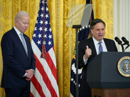 US President Joe Biden (L) listens to outgoing White House Chief of Staff Ron Klain speak
