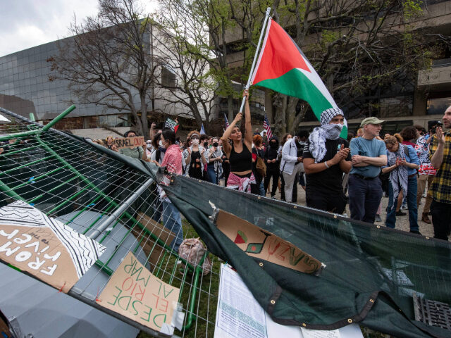 Pro-Palestinian supporters chant as they retake the encampment at the Massachusetts Instit