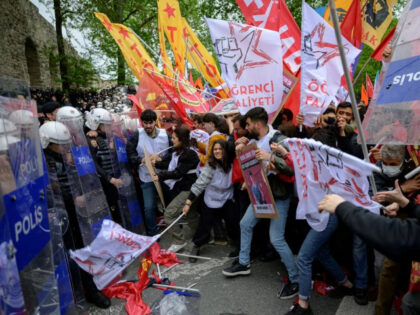Protesters scuffle with riot police as they attempt to defy a ban and march on Taksim Squa
