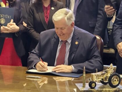 Missouri's Republican Gov. Mike Parson signs a bill to block Medicaid payments for Pl