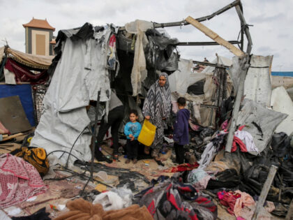 Displaced Palestinians inspect their tents destroyed by Israel's bombardment, adjunct …