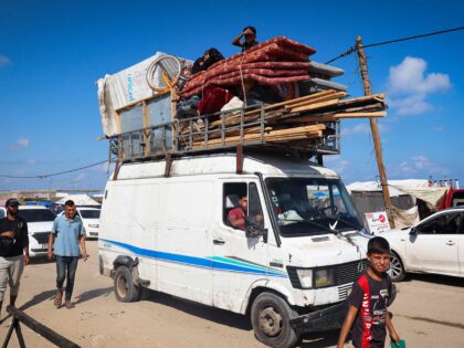 Displaced Palestinians leave an unsafe area in Rafah on May 15, 2024, as Israeli forces co