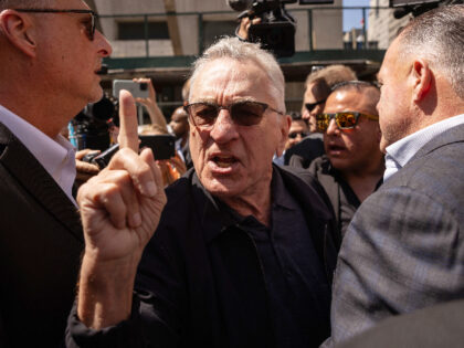 Actor Robert De Niro, center, points to a supporter of former US President Donald Trump, n