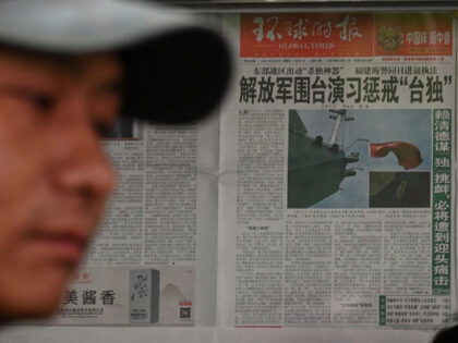 A Chinese newspaper front page shows news coverage of China's military drills around