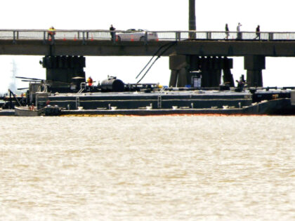 Officials respond after the Pelican Island Bridge was closed when a passing barge struck o