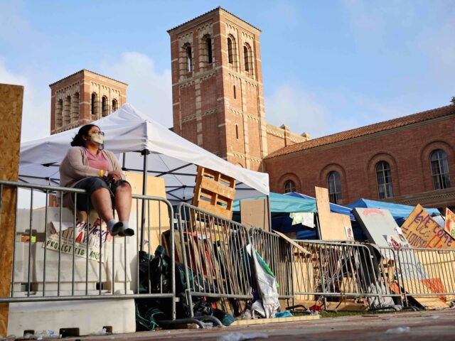 LOS ANGELES, CALIFORNIA - MAY 01: A protestor sits along barricades at a pro-Palestinian e