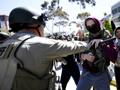 Police officers clash with Pro-Palestinian protesters at UC San Diego, Monday, May 6, 2024