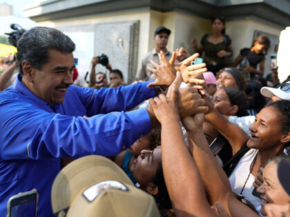 Venezuelan President Nicolas Maduro greets supporters during a march of evangelical Christ