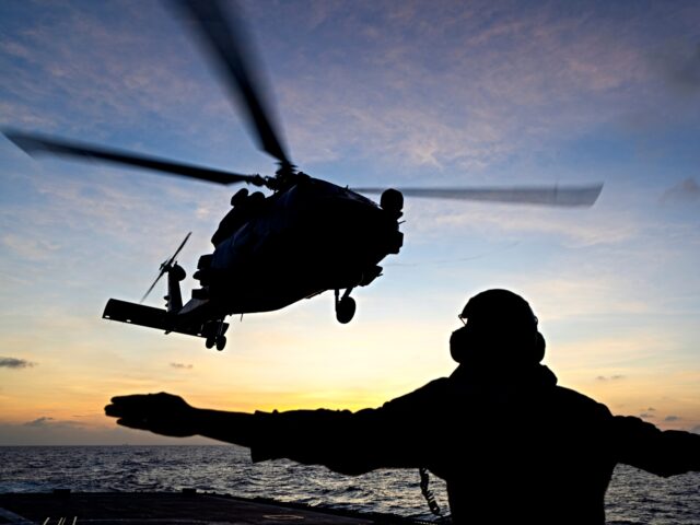 HMAS Toowoomba’s MH-60R Seahawk helicopter “Valkyrie” conducts flying exercises duri