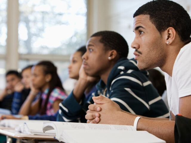 Students are listening in their classroom.