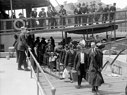 Newly arrived immigrants disembark from the passenger steamer Thomas C. Millard upon their