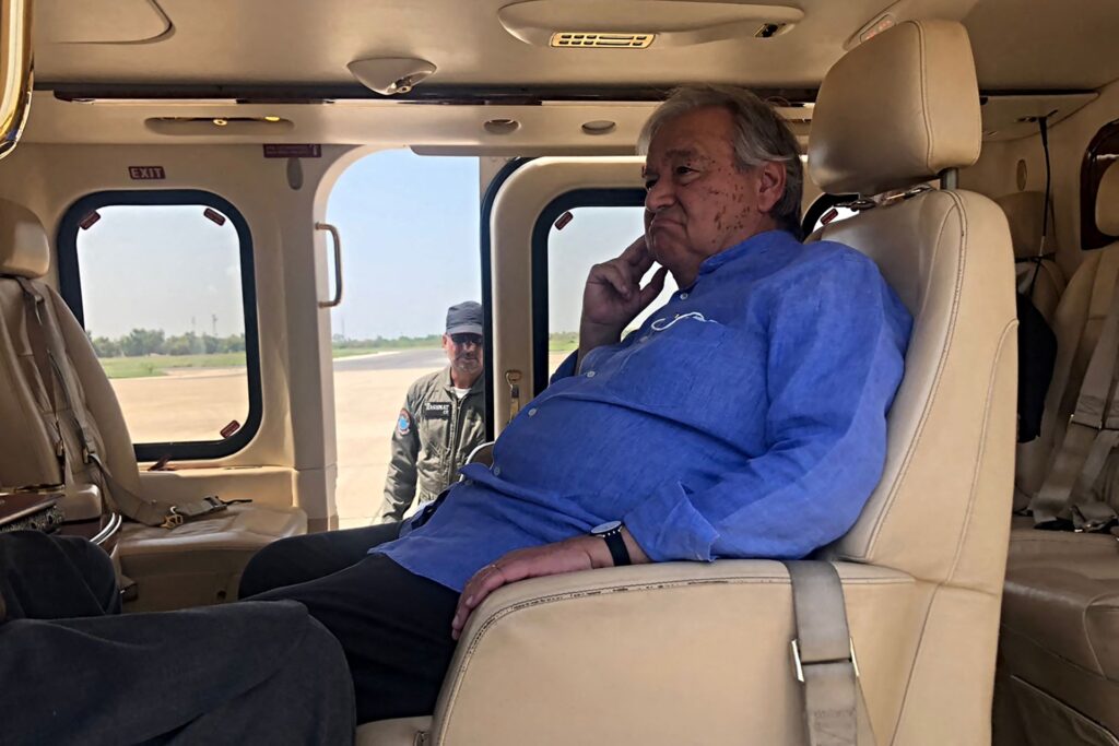 United Nations Secretary-General Antonio Guterres sits in a helicopter during his visit to flood-affected areas in Pakistan's Sindh province on September 10, 2022. - United Nations Secretary-General Antonio Guterres said developing nations were paying a "horrific price" for the world's reliance on fossil fuels, as he toured parts of Pakistan hit by floods blamed on climate change. (Photo by Muhammad DAUD / AFP) (Photo by MUHAMMAD DAUD/AFP via Getty Images)