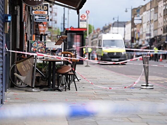 Police at the scene of a shooting at Kingsland High Street, Hackney, east London, where th