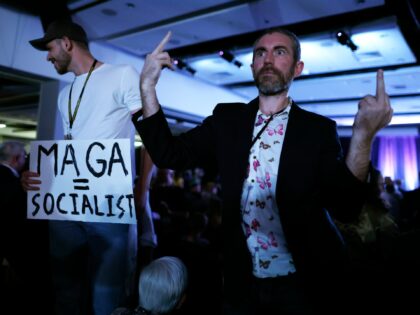 WASHINGTON, DC - MAY 25: (EDITORS NOTE: Image contains profanity.) Libertarians taunt and