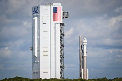 A Boeing Starliner capsule atop an Atlas V rocket sits on the launch pad at Cape Canaveral