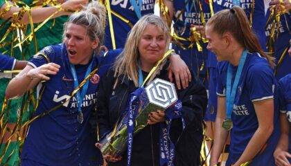 Chelsea manager Emma Hayes holds the trophy after her team's Women's Super League title-cl