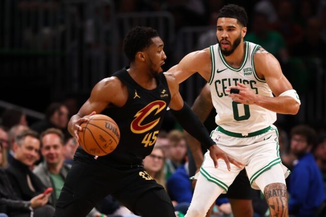 Cleveland's Donovan Mitchell drives against Jayson Tatum in the Cavaliers' victory over th