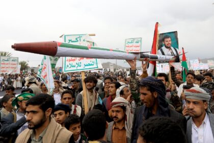 Demonstrators carry a mock missile during a pro-Palestinian and anti-Israel rally in Yemen