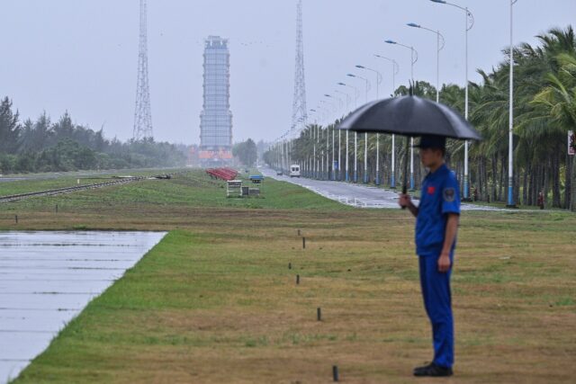 A guard stands watch near the launch platform for the Chang'e-6 lunar mission