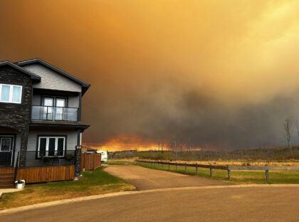 This handout image courtesy of Kosar shows smoke and flames from the fire in Fort McMurray