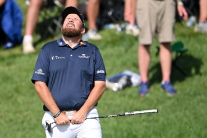 Ireland's Shane Lowry reacts on the 18th green after matching the all-time low round in ma