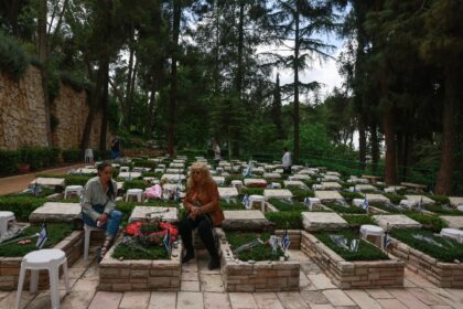 Israelis visit the graves of fallen soldiers at Jerusalem's Mount Herzl military cemetery