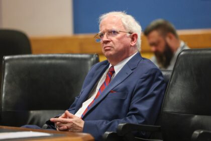 John Eastman, seen here in a Georgia courtroom, denies Arizona charges that he tried to su