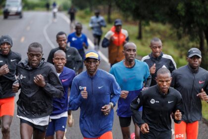 Kenya's Olympic marathon champion Eliud Kipchoge (centre) runs with fellow athletes in Kap