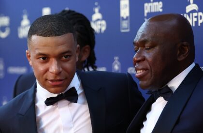 Kylian Mbappe (L) arriving with his father Wilfried at French football's annual awards cer