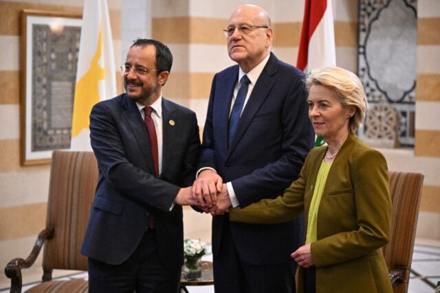 Lebanon's Prime Minister Najib Mikati (C) with European Commission President Ursula von de