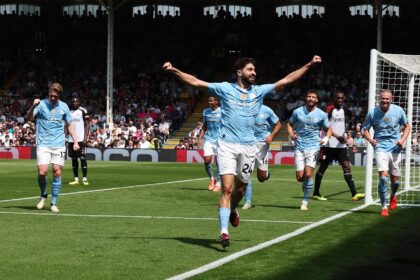 Manchester City defender Josko Gvardiol (C) celebrates scoring against Fulham