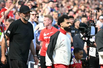 Mohamed Salah (centre) hinted he will remain at Liverpool next season