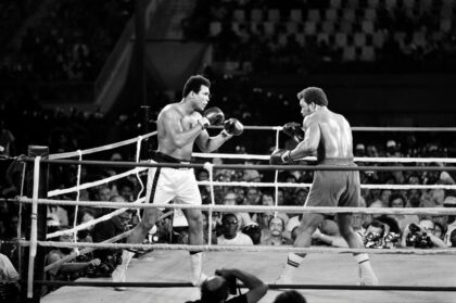 Muhammad Ali (L) reclaiming his world titles from George Foreman in Kinshasa, Zaire, in 19