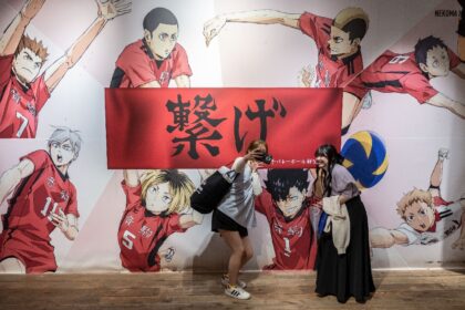 People take selfies at a pop-up store for the Japanese volleyball manga series "Haikyu!!"