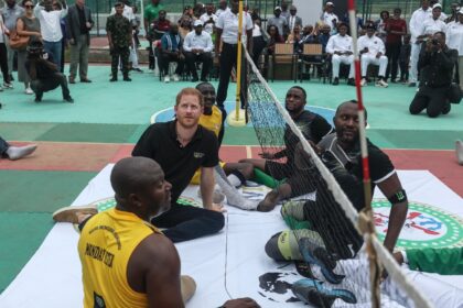 Prince Harry (2nd L) playing sitting volleyball in a match in Nigeria