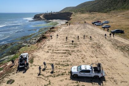 State prosecutors search the camping site of two Australians and an American murdered duri