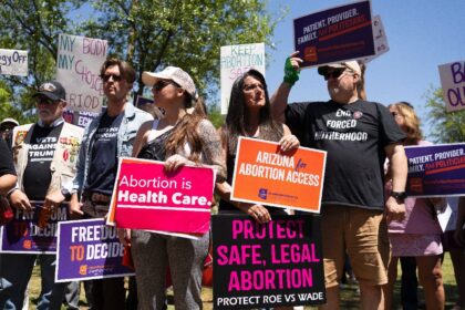 Protesters condemn Arizona's 1864 abortion ban at the state House of Representatives in Ap