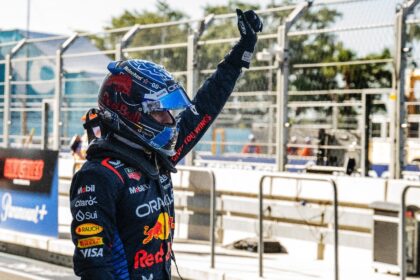 Red Bull Racing's Dutch driver Max Verstappen celebrates winning the pole position after t