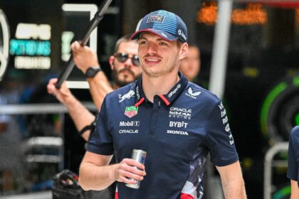 Red Bull Racing's Dutch driver Max Verstappen walks in the paddock ahead of the 2024 Miami