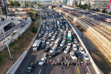 Relatives and supporters of Israeli hostages held in Gaza block Ayalon Highway in Tel Aviv