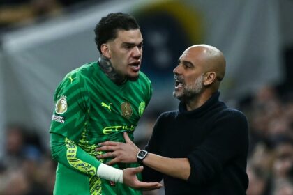 Reluctant to come off: Manchester City goalkeeper Ederson (L) argues with manager Pep Guar