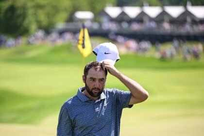 World number one Scottie Scheffler walks off the 18th green in the final round of the PGA