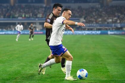 Sergino Dest of the United States blocks out Hirving Lozano of Mexico in the 2024 CONCACAF