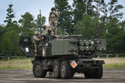Soldiers put up the antenna of a HIMARS rocket system as part of the Balikatan military ex