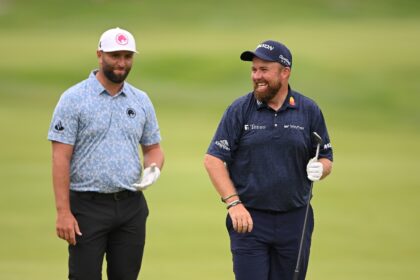 Spain's Jon Rahm, left, chats with past European Ryder Cup teammate Shane Lowry of Ireland