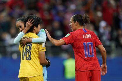 Sukanya Chor Charoenying is consoled by a teammate and the USA's Carli Lloyd, who 'told m