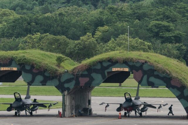 Taiwanese Air Force F-16 fighter jets parked under shelters at an air force base in Hualie