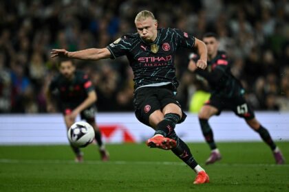 On target: Manchester City's Erling Haaland scores his second goal, from the penalty spot,