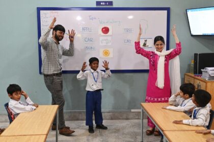 Teachers lead a class of hearing-impaired students at a school in Lahore run by the charit